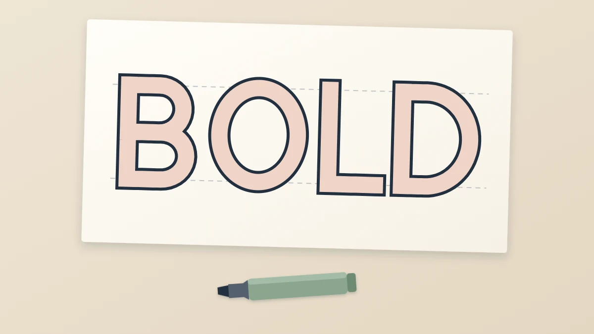 The word BOLD in large outlined block capitals with a blush pink fill on a sheet of paper, a broad marker lying below